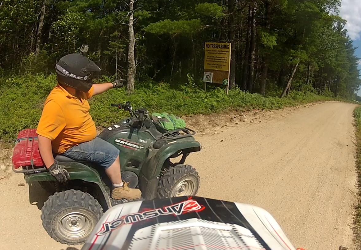 Mixed_messages_on_the_trail_A_no_trespassing_sign